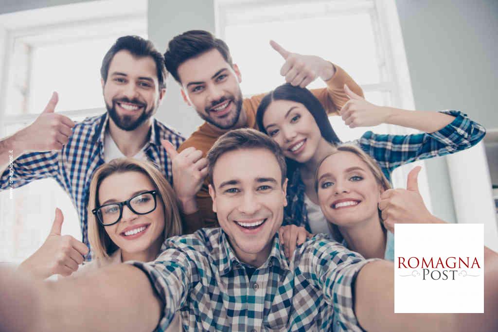 Self portrait of economists, students, financiers, lawyers in casual outfit showing thumb up with fingers shooting selfie on front camera with joyful cheerful expression having leisure, timeout