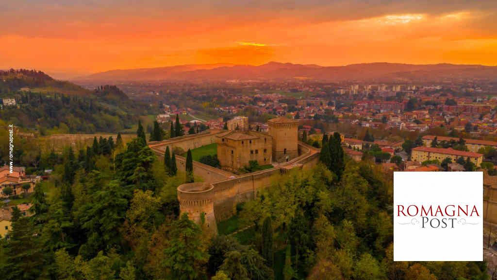 Sunset aerial panorama of Cesena in Emilia Romagna Italy near Forli and Rimini, with the medieval Malatestiana castle, Piazza del Popolo and Roman Catholic churches and cathedral on a winter afternoon