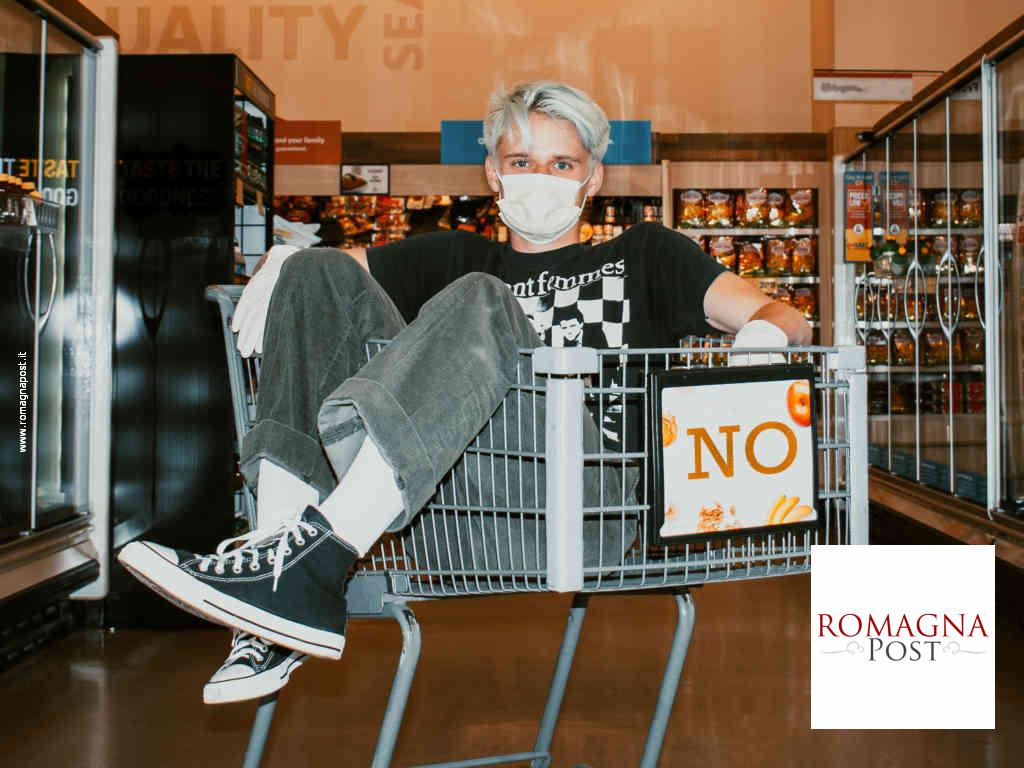 Young man at supermarket with mask