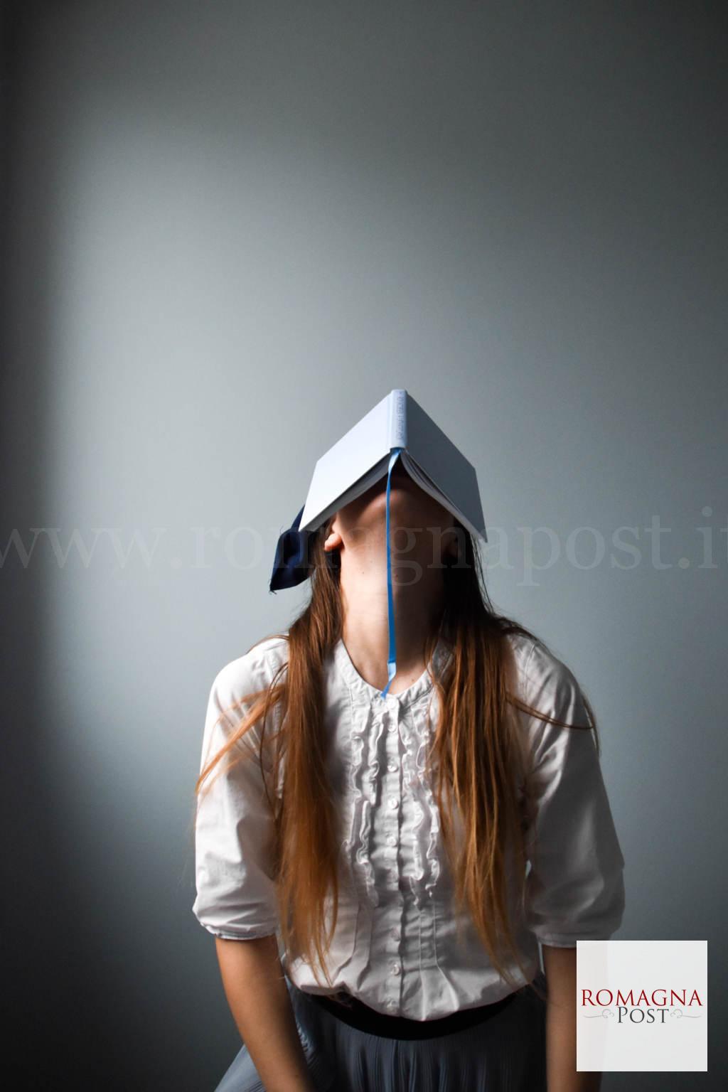 Woman in white long sleeve shirt wearing black and white cap
