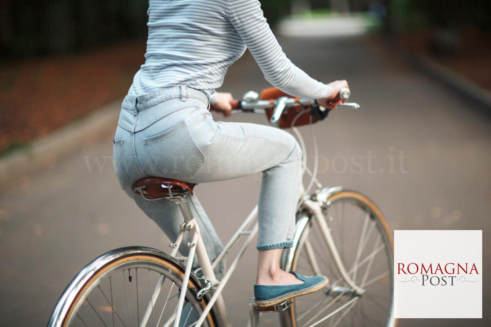 Woman in white and black striped long sleeve shirt and blue deni