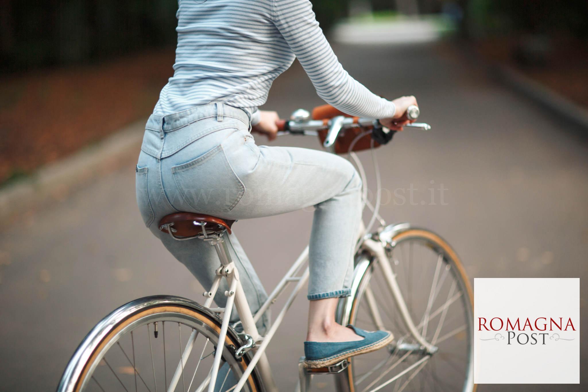 Woman in white and black striped long sleeve shirt and blue deni