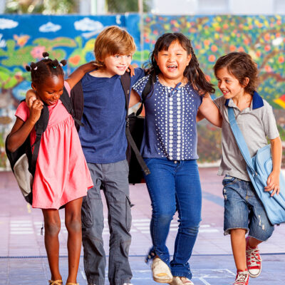 Schoolchildren,Embracing,Happy.,Multi,Cultural,Racial,Classroom.